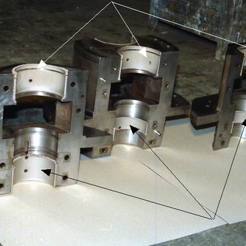 Bearing shafts with electroplated nickel (arrows). The base material will have a much higher wear resistance.
